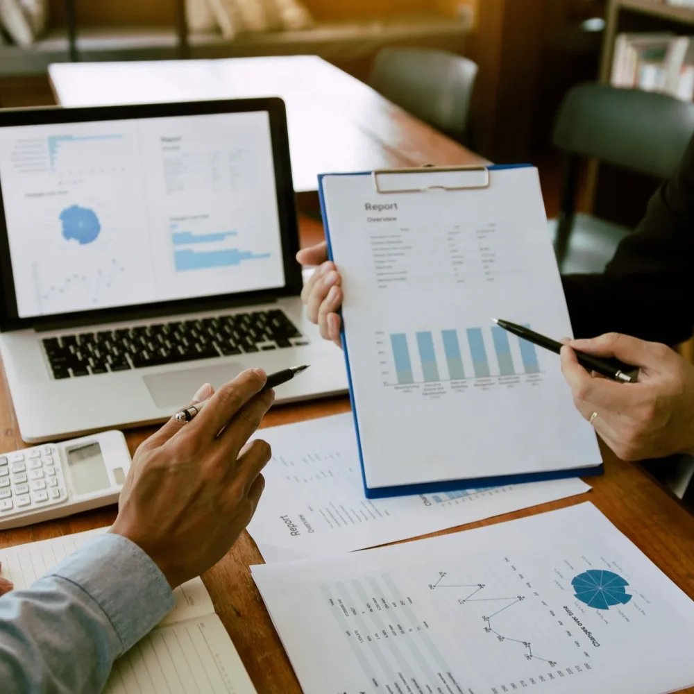 two-business-partnership-coworkers-analysis-strategy-with-discussing-a-financial-planning-graph-and-2